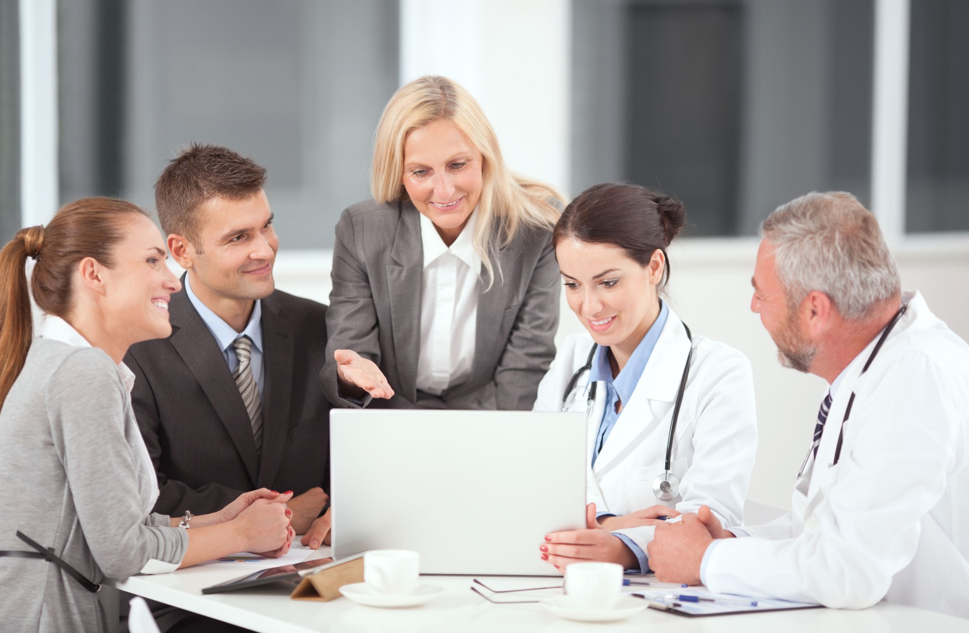 Doctors looking at a laptop computer